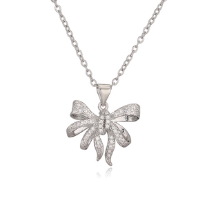 Elegant silver bow pendant necklace with sparkling cubic zirconia on white background