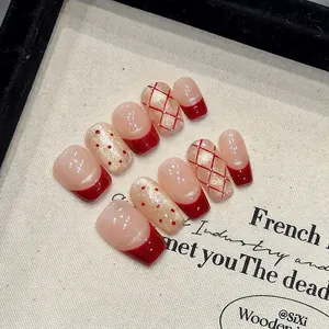 Handmade red polka dot and plaid french press-on nails with golden cat-eye finish