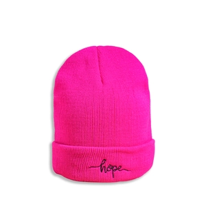 Close-up of pink knit beanie with black Hope embroidery on the rolled cuff