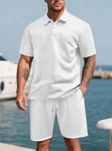 Detailed texture of white waffle knit polo set with textured diamond fabric pattern