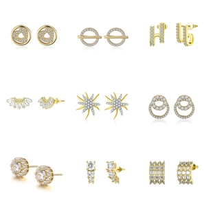Collection of nine gold S925 sterling silver earrings with heart and geometric patterns