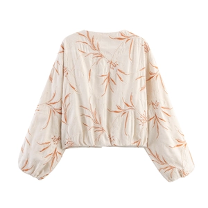 Short embroidered jacket with orange leaf patterns and stylish puff sleeves in beige
