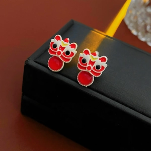 Detail of red lion dance stud earrings with colorful enamel and round red gemstone