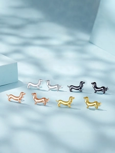 Detailed macro view of S925 sterling silver dachshund dog stud earrings in four metallic colors