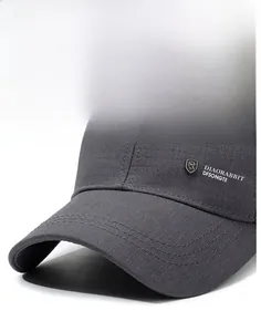 Detail of grey baseball cap showing sturdy brim with fine stitching and textured fabric