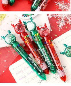 Close-up of four Christmas reindeer ballpoint pens with red and green sequin toppers