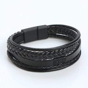Close-up of black braided leather multilayer bracelet with magnetic metal clasp
