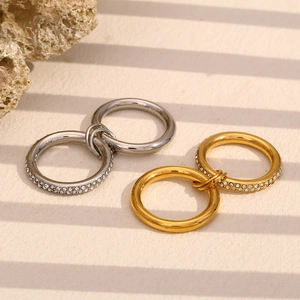 Detail of double layered 18K gold plated ring with sparkling diamonds and shadows