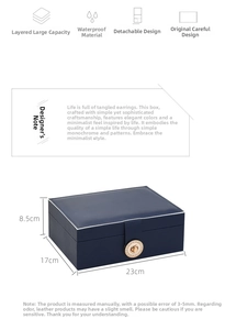 Detail view of navy blue faux leather jewelry box showing dimensions 23x17x8.5cm with lock