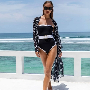 Elegant black one-piece swimsuit with white waist belt and polka dot chiffon cover-up