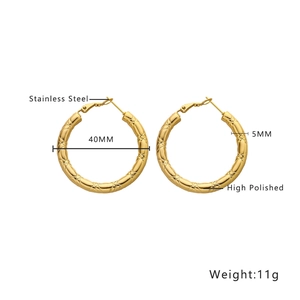 Detailed view of 40mm golden hollow hoop earrings with textured diamond pattern
