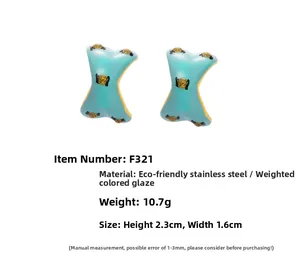 Detail showing dimensions and 10.7g weight for blue enamel X-shaped steel earrings