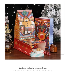Detailed view of Christmas kraft paper gift bags with reindeer designs and golden clips