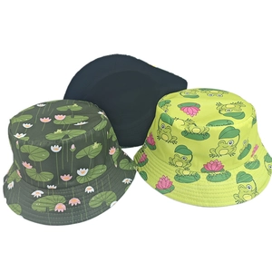 Detailed view of printed bucket hats in lotus pattern, frog print, and solid black color