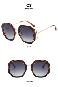 Detail view of tortoiseshell polygon sunglasses with rivets and gradient lenses
