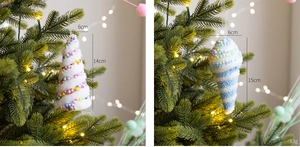 Close-up of plush white and blue striped cone Christmas ornaments hanging on a tree