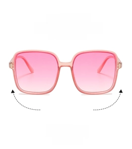 Detail of square oversized pink gradient sunglasses with transparent designer frame