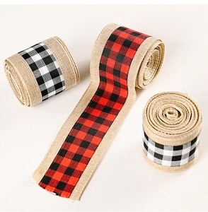 Detail of burlap buffalo plaid ribbons in red and black for Christmas rustic decoration