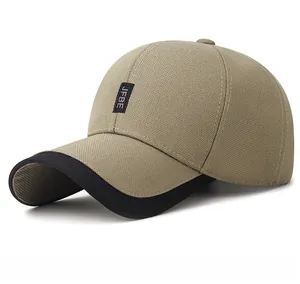 Detail of JFBE embroidered patch on khaki outdoor baseball cap with black brim underside