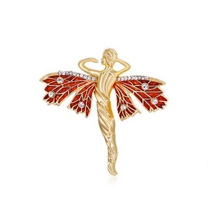 Close-up of a gold-plated winged brooch featuring red enamel wings and sparkling rhinestones