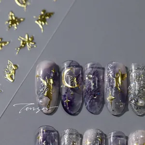 Macro detail of fairy themed nail stickers with gold foil moons and purple marble texture