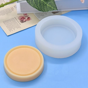 Round silicone mold for DIY baking and handmade crafts with finished orange resin sample