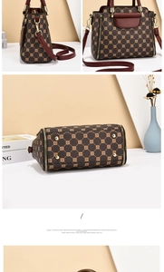 Detail view showing bottom studs and side profile of the brown monogram Boston handbag
