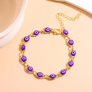 Detail of Turkish purple evil eye bracelet with golden lobster clasp and extender