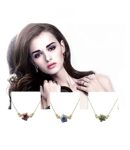 Detailed view of colorful star ceramic pendants with golden bead chains for women