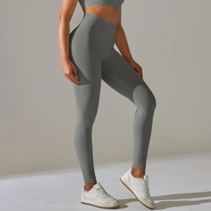 Close-up of seamless knitted texture on light gray high-waisted yoga leggings
