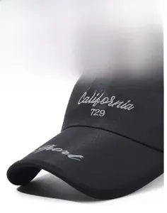 Detail of black sun visor with white DESTINY embroidery and breathable mesh texture