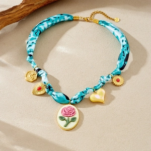 Vintage gold oval pendant necklace with pink rose cameo and blue leopard print cloth chain