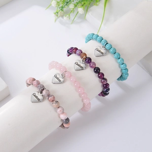 Pink Zebra Stone beaded bracelets with customizable heart charms and natural gemstones