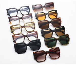 Flat lay of retro oversized square sunglasses in black, tortoiseshell and leopard print