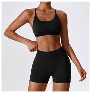 Detail of black seamless yoga set showing breathable knit texture and high-waist shorts