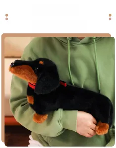 Detailed view of the large black and tan plush dachshund toy with a red collar