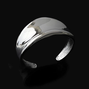 Minimalist wide open cuff bracelet with irregular organic shape and polished silver finish