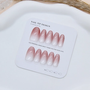 Plum ombre cat-eye press-on nails with shimmering magnetic finish on display card