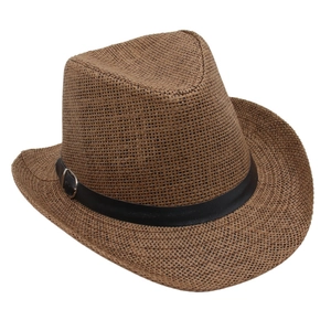 Detailed view of a brown woven straw cowboy hat with a black leather decorative band.