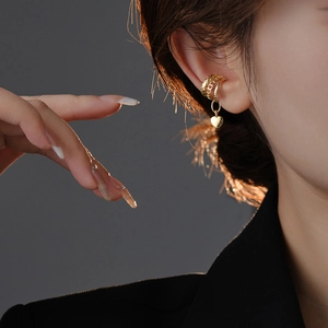 Elegant gold heart charm ear bone clip for women with multi-layer textured ring design