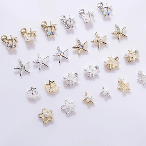 Detailed set of gold and silver starfish and moon stud earrings with pearls and rhinestones