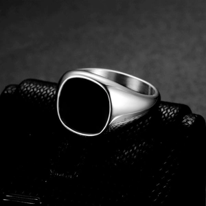 Minimalist silver stainless steel signet ring with black circular enamel top for men