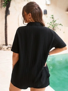 Women's black textured short sleeve shirt with high waist shorts for summer vacation