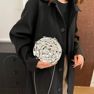 Silver 3D rose flower evening bag with metallic finish and thin chain shoulder strap