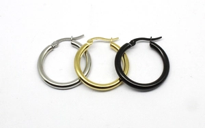 Detail of 3mm thick stainless steel hoop earrings in gold, silver, and black finishes