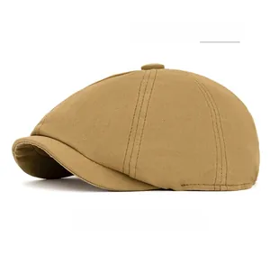 Close-up of khaki octagonal newsboy cap showing high-density twill cotton texture