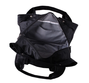 Top view of nylon mommy bag showing spacious interior with classic black and white striped lining