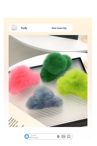 Detailed view of four fluffy faux fur hair claw clips in vibrant pink green and blue tones