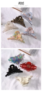 Macro view of French acetate bow hair claws in leopard print and morandi color options