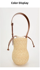 Detail of handmade straw bucket bag featuring leather adjustable strap and drawstring liner